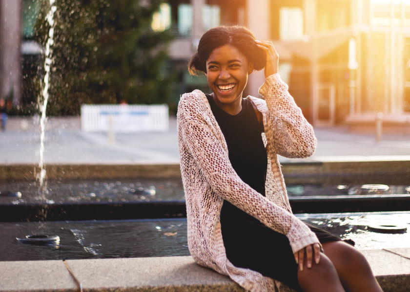 Woman Smiling at Fountain